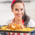 Traditional Peking Duck served with hoisin sauce, thin pancakes, and fresh scallions on a wooden platter