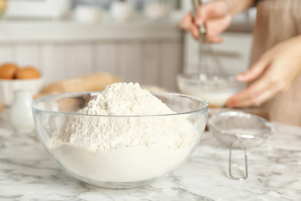 Homemade self-rising flour made with only three ingredients in a mixing bowl