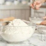 Homemade self-rising flour made with only three ingredients in a mixing bowl