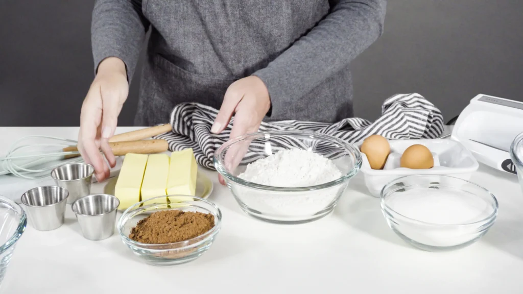 Chewy snickerdoodle cookies coated in cinnamon sugar on a baking tray