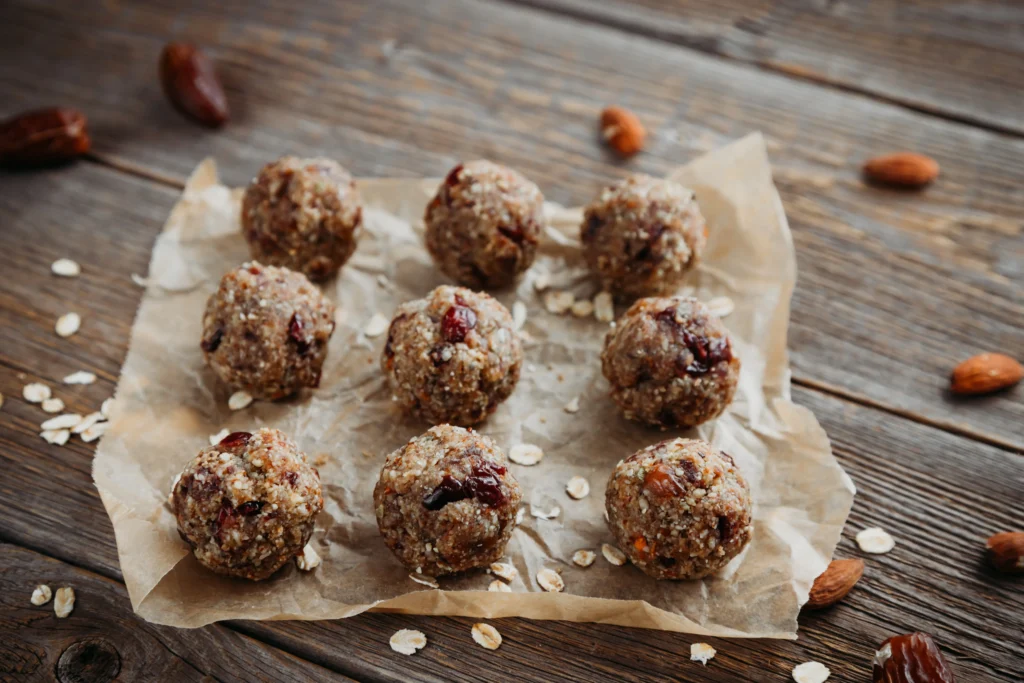 Healthy protein balls made with oats, nut butter, and protein powder, arranged on a plate for meal prep and fitness snacks