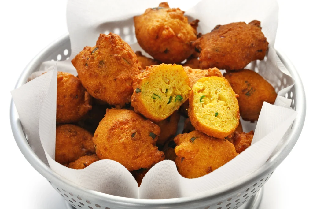 Crispy Hush Puppy
Golden crispy hush puppies served hot with fried fish and lemon wedges on a rustic plate