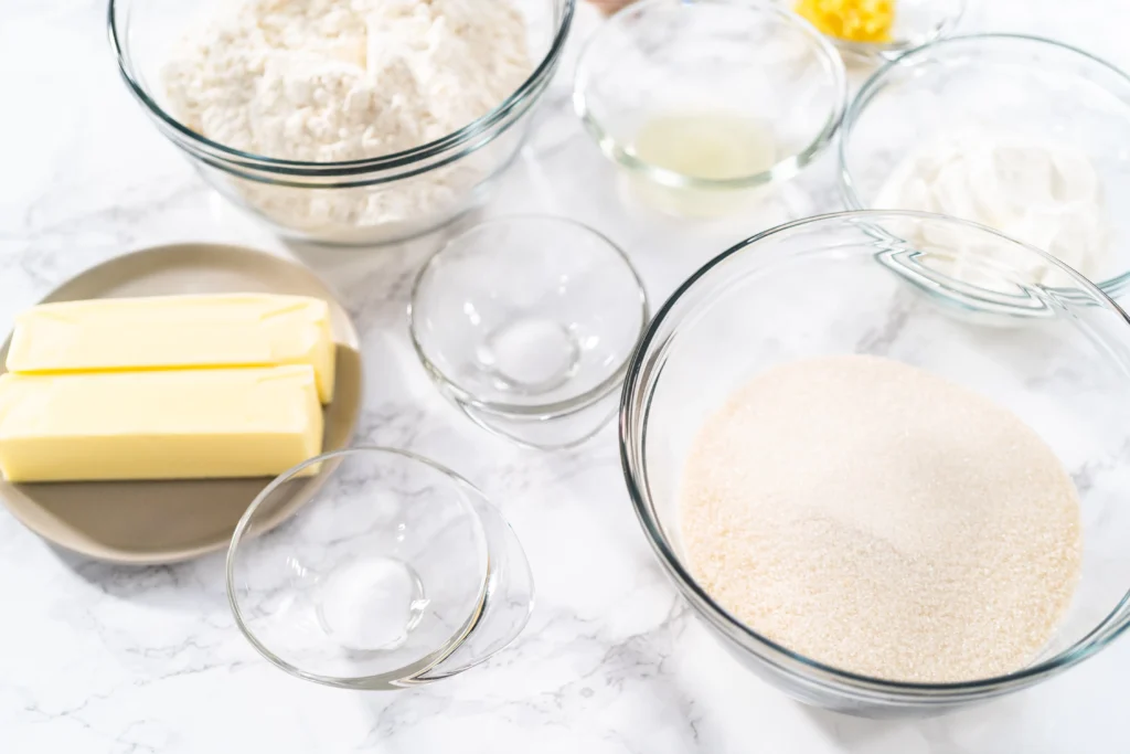Holiday Spritz cookies freshly baked and decorated with colorful sprinkles on a festive platter