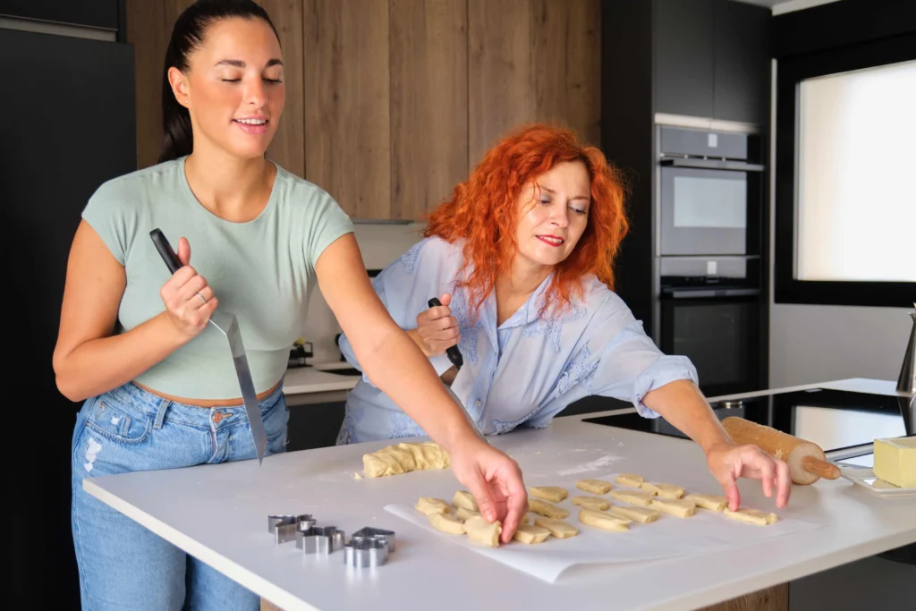 Holiday Spritz cookies freshly baked and decorated with colorful sprinkles on a festive platter
