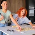 Holiday Spritz cookies freshly baked and decorated with colorful sprinkles on a festive platter