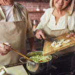 Creamy one-pot chicken gnocchi soup with spinach and carrots in a rustic bowl
