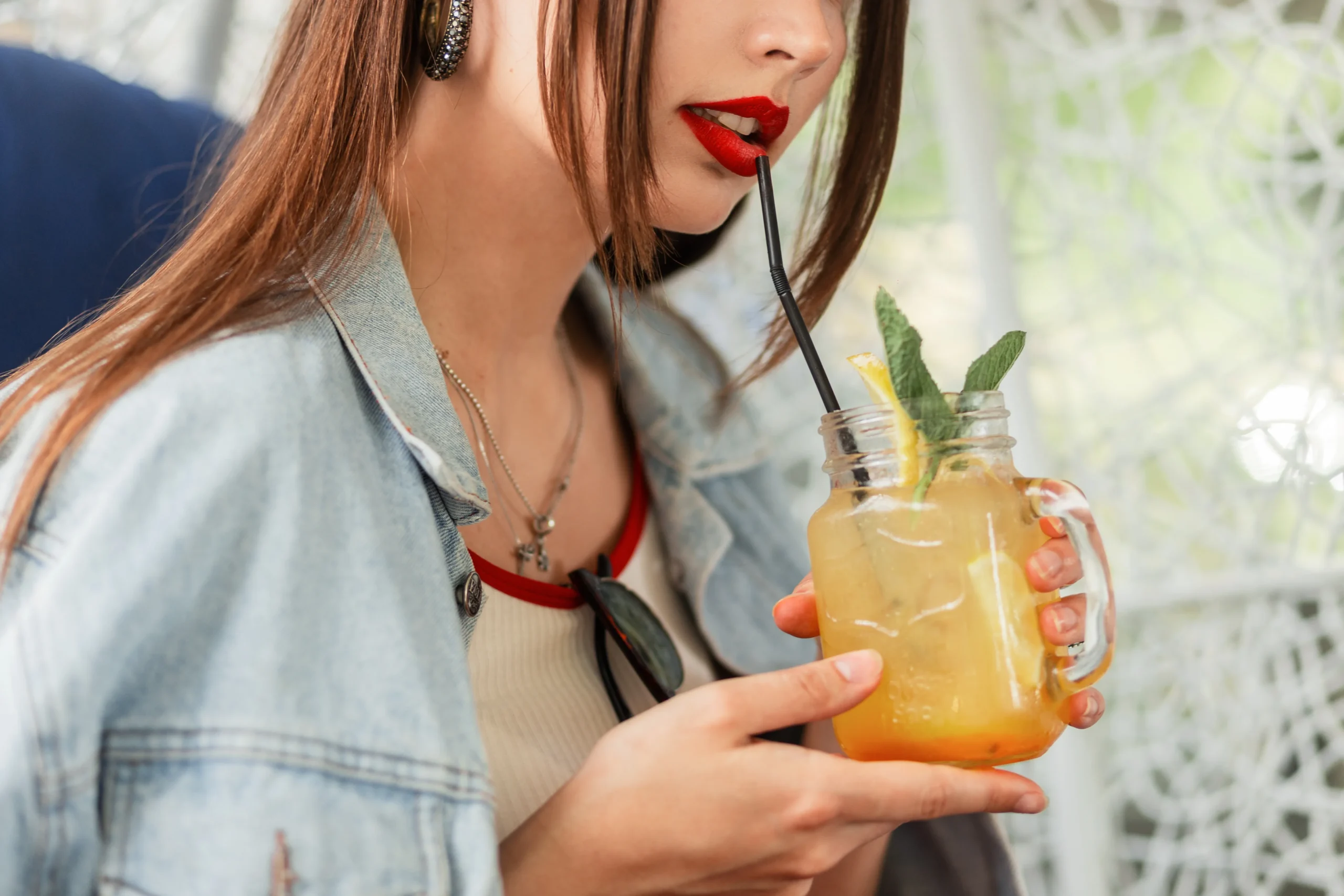 A glass of sweet, fruity Painkiller cocktail with tropical fruit garnish, ready to serve