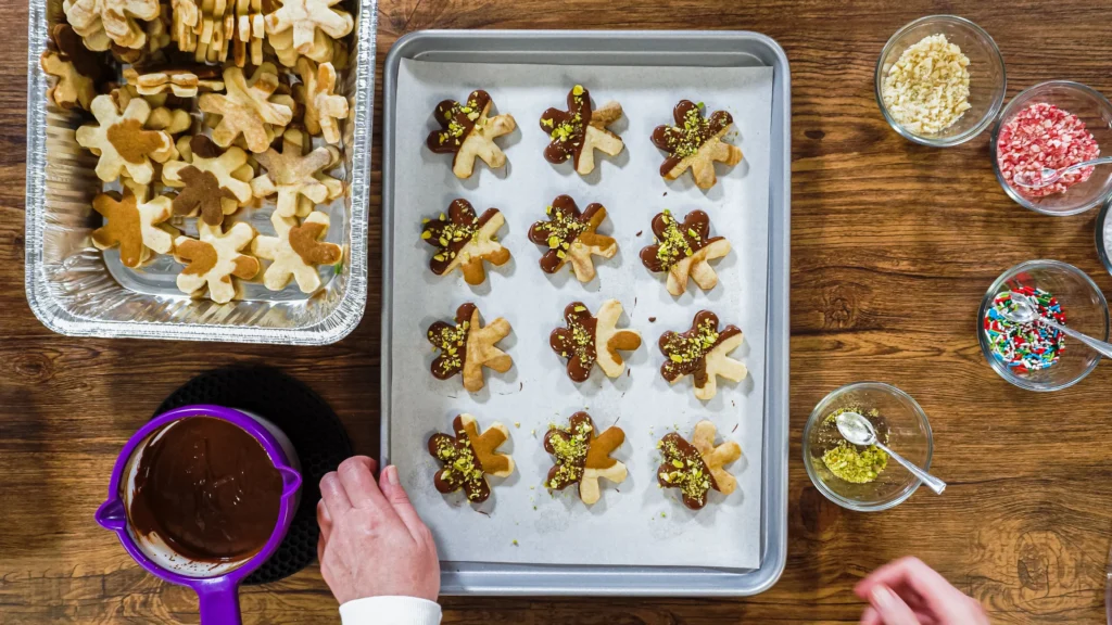 Holiday Spritz cookies freshly baked and decorated with colorful sprinkles on a festive platter