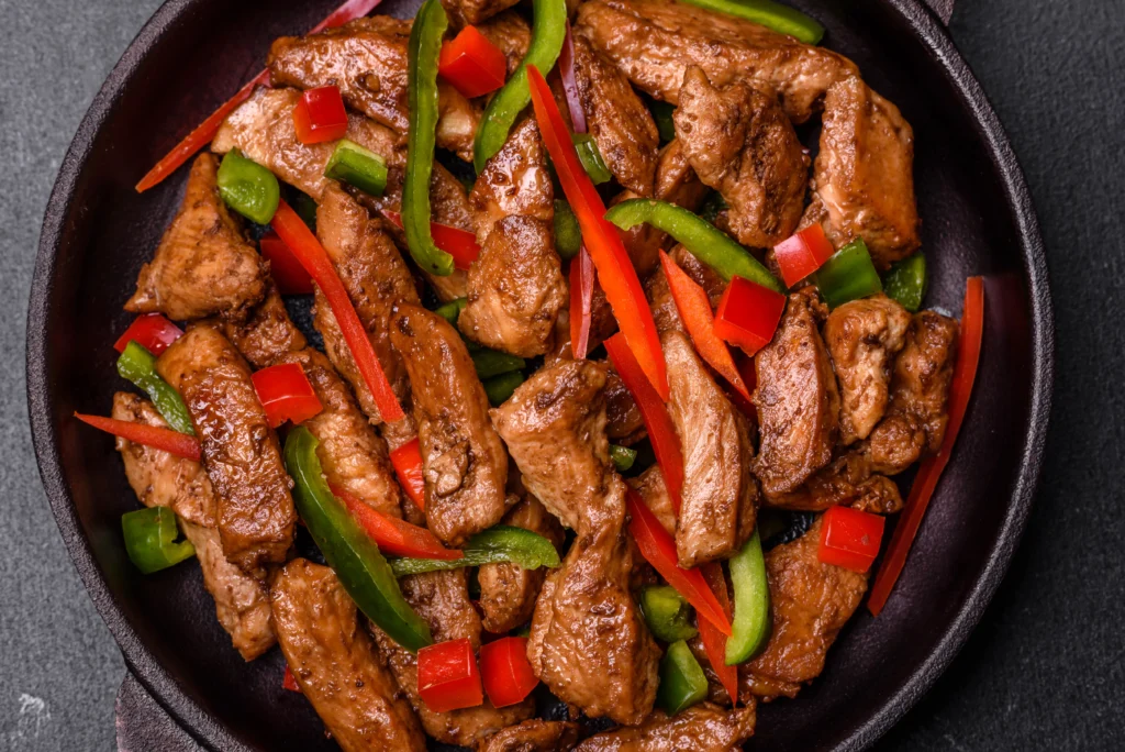 Juicy pepper steak with tender beef strips, colorful bell peppers, and savory sauce in a skillet