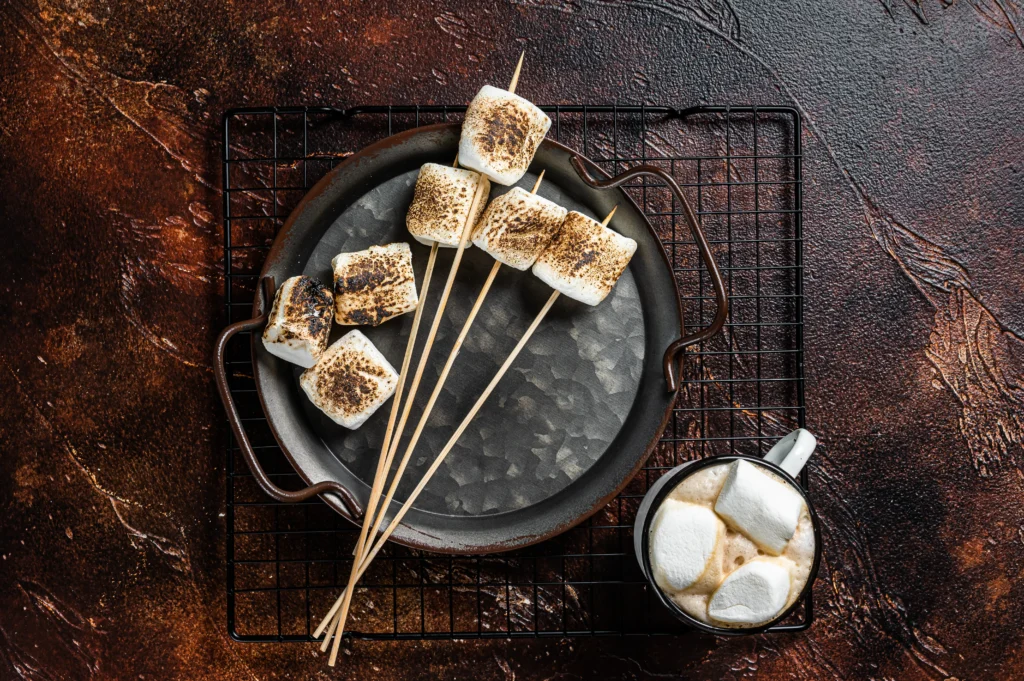 Marshmallow Recipe
Soft, fluffy homemade marshmallows dusted with powdered sugar, cut into cubes and served on a rustic wooden board.