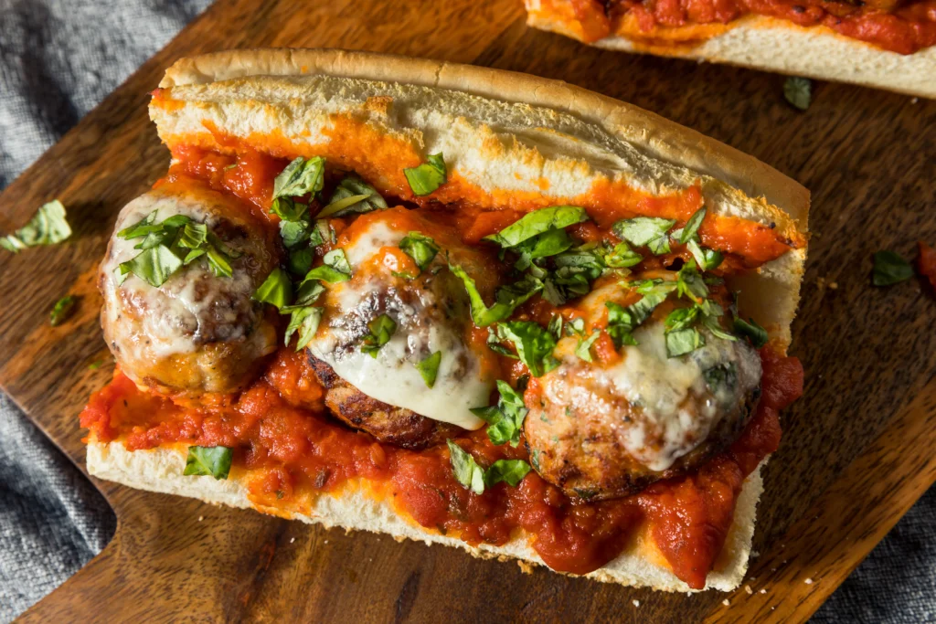 Delicious homemade meatball sub sandwich with melted cheese and marinara sauce