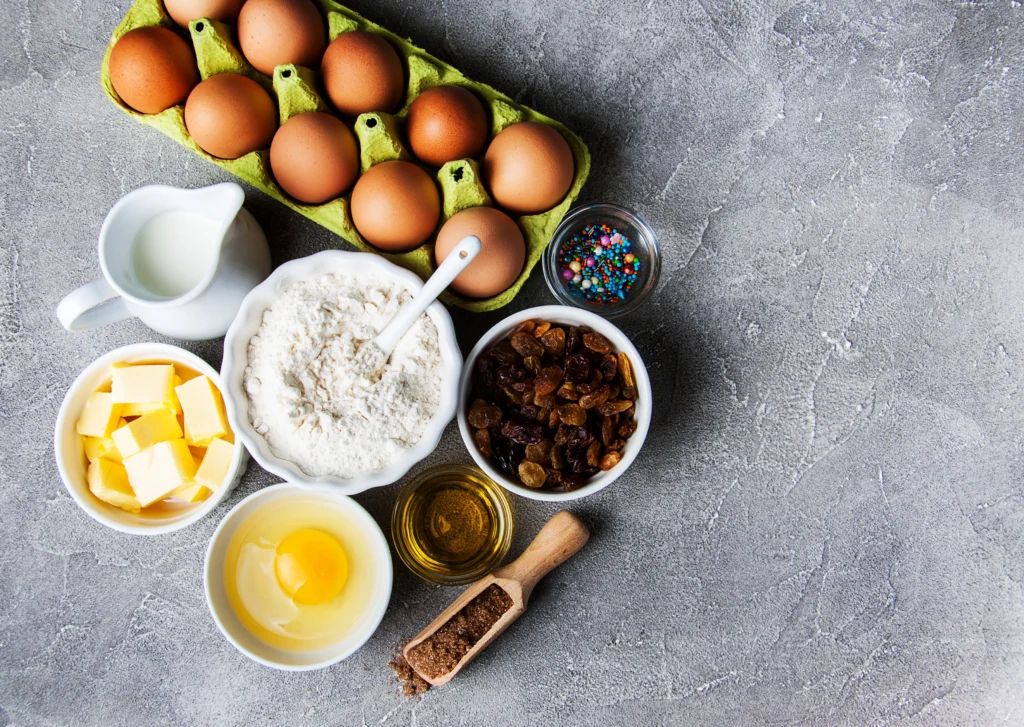 King Cake Recipe
Homemade King Cake decorated with purple, green, and gold sugar icing, sliced to reveal soft cinnamon filling inside on a festive table