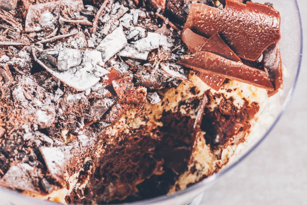 Dirt Pudding Recipe
A fun dirt pudding dessert served in clear cups, layered with creamy chocolate pudding, crushed chocolate cookies, and gummy worms on top.