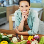 A bowl of creamy Rotel dip made with melted cheese, ground beef, and tomatoes with chilies, served with tortilla chips for game day