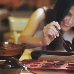 Romantic lava cake with molten chocolate center served on a plate with strawberries and ice cream for a date night dessert