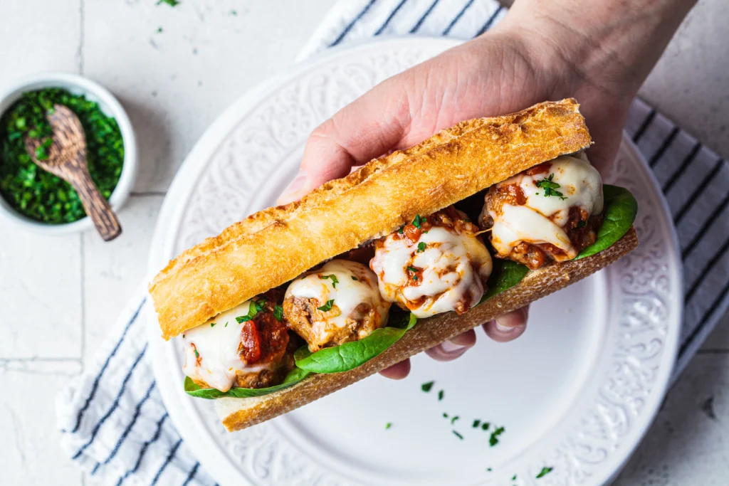 Delicious homemade meatball sub sandwich with melted cheese and marinara sauce