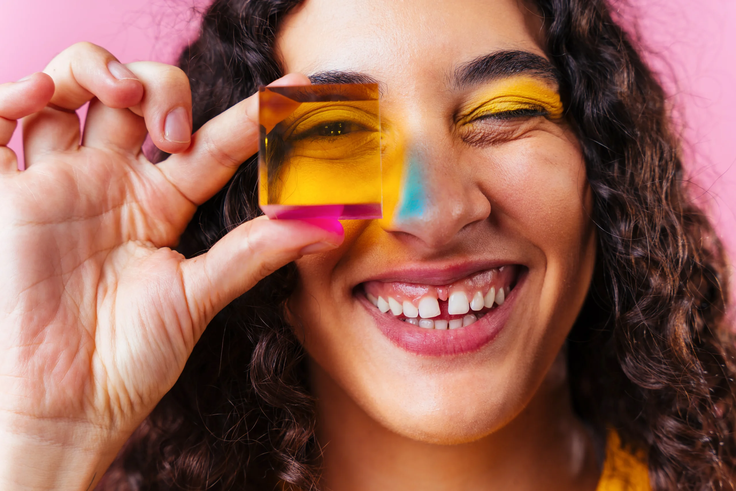 Colorful homemade jello shots arranged on a party table with fresh fruit garnishes and festive lighting