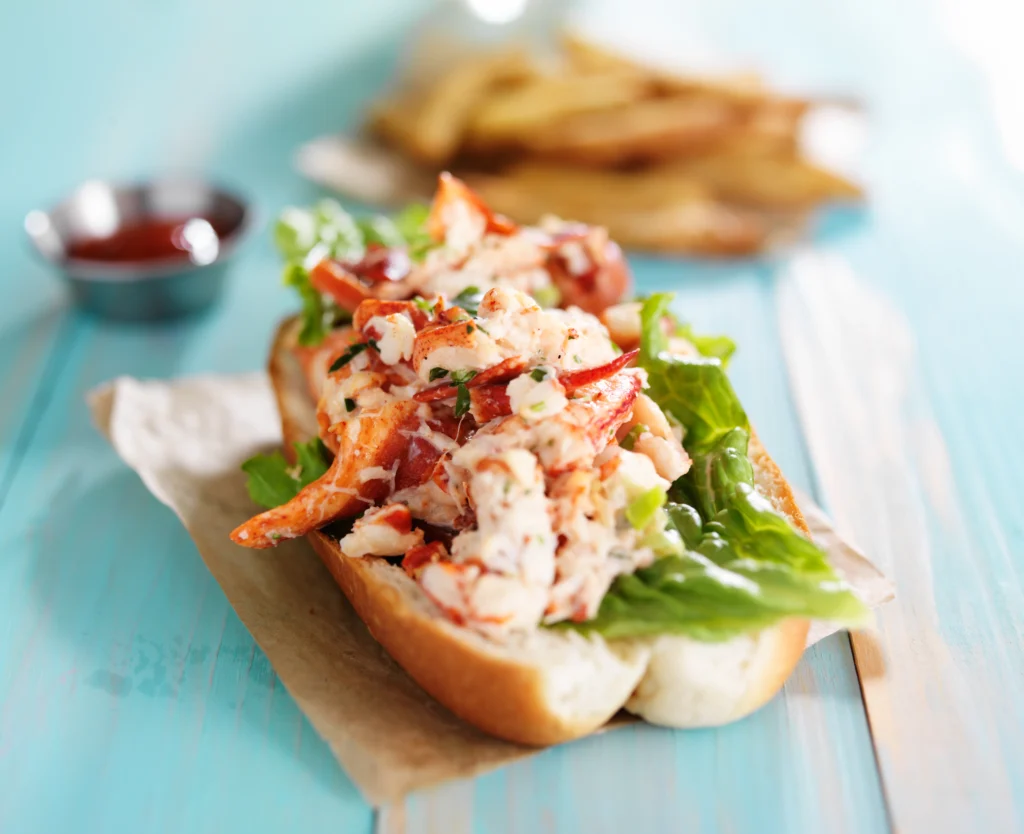 Buttery lobster roll served in a toasted bun with fresh herbs and melted butter