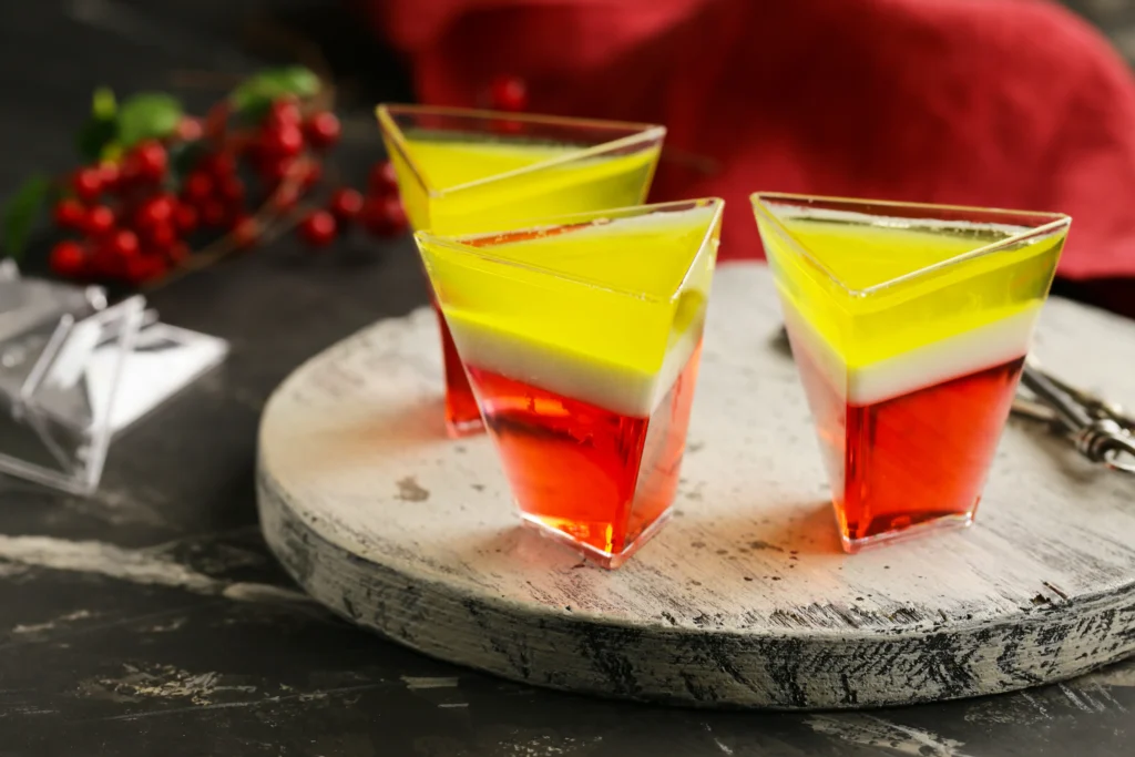 Jello Shot Recipe
Colorful homemade jello shots arranged on a party table with fresh fruit garnishes and festive lighting