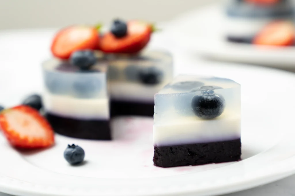 Jello Shot Recipe
Colorful homemade jello shots arranged on a party table with fresh fruit garnishes and festive lighting