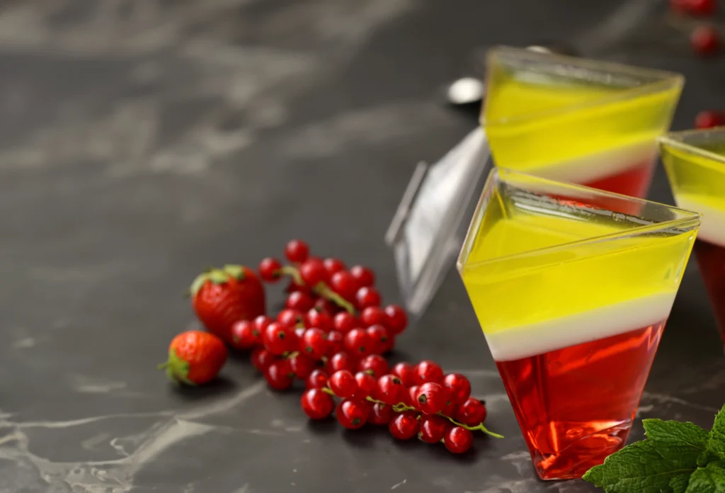 Jello Shot Recipe
Colorful homemade jello shots arranged on a party table with fresh fruit garnishes and festive lighting