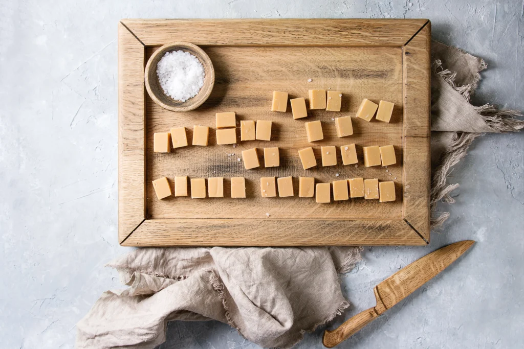 Easy Peanut Butter Fudge made with 3 ingredients, creamy homemade dessert squares on parchment paper