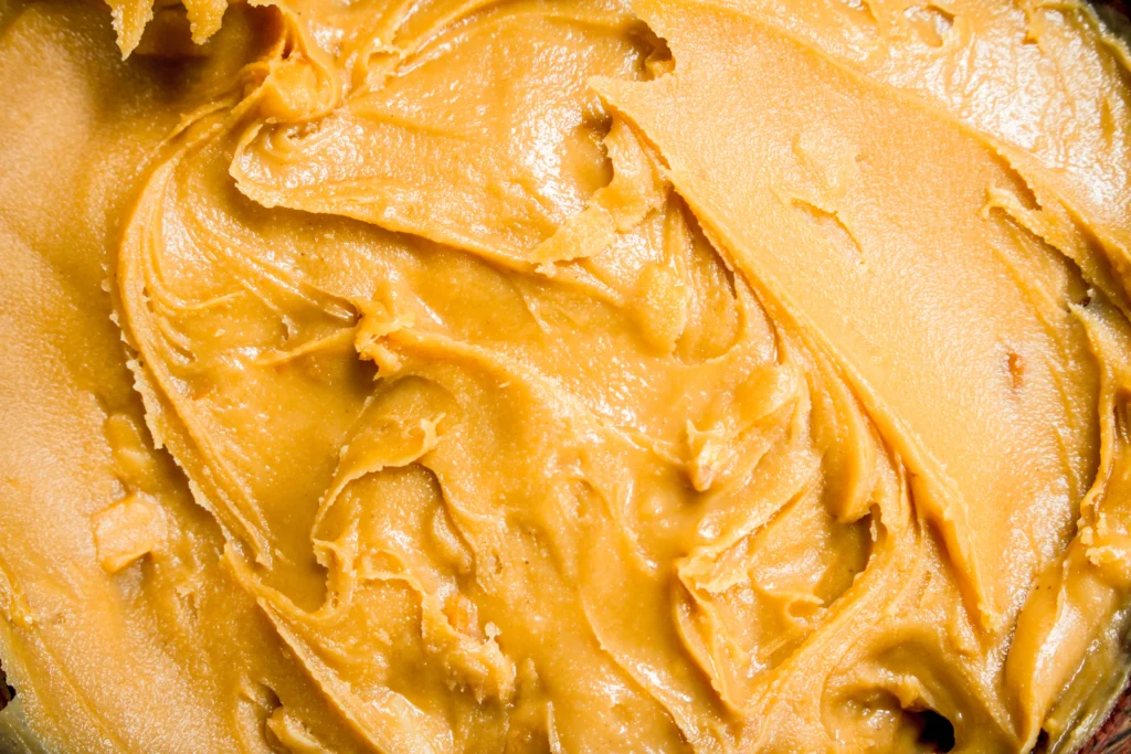 Easy Peanut Butter Fudge made with 3 ingredients, creamy homemade dessert squares on parchment paper
