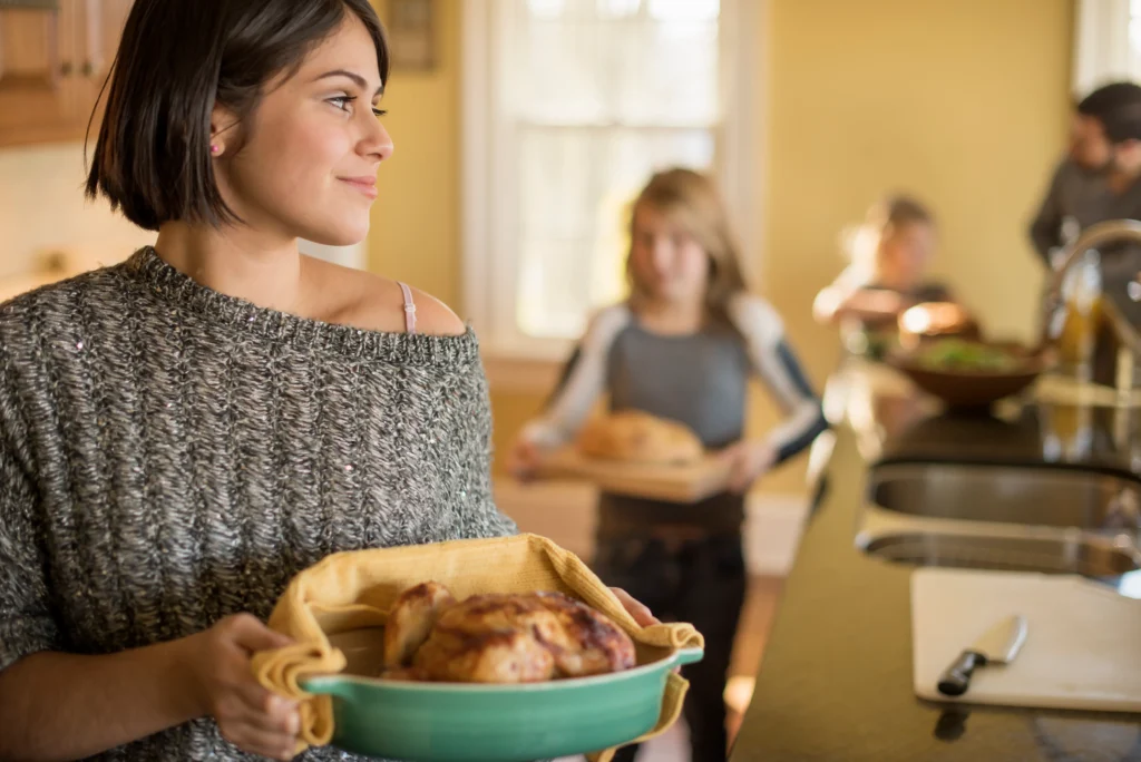 Golden roasted Cornish hen seasoned with garlic and fresh herbs, served on a rustic platter with roasted vegetables for a simple flavorful dinner.