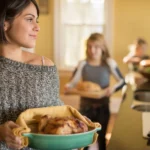 Golden roasted Cornish hen seasoned with garlic and fresh herbs, served on a rustic platter with roasted vegetables for a simple flavorful dinner.