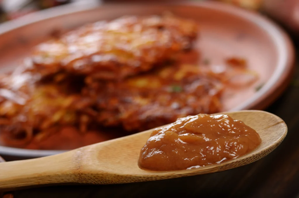 Brown gravy recipe in a skillet, rich homemade gravy with smooth texture, served with mashed potatoes.