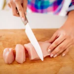 Creamy Marry Me Chicken Pasta served in a rustic bowl, featuring tender chicken pieces, sun-dried tomatoes, Parmesan cheese, and fresh basil garnish.