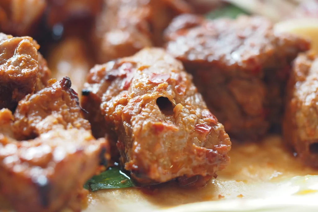 Garlic Butter Steak Bites cooked to perfection in a skillet, coated in rich garlic butter sauce and garnished with fresh parsley.