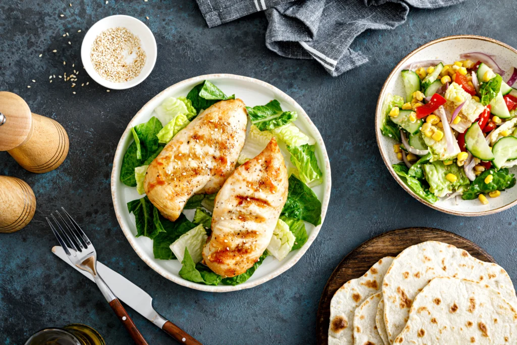Grilled Chicken Caesar Wraps filled with juicy grilled chicken, crisp romaine lettuce, Parmesan cheese, and creamy Caesar dressing wrapped in a soft tortilla.