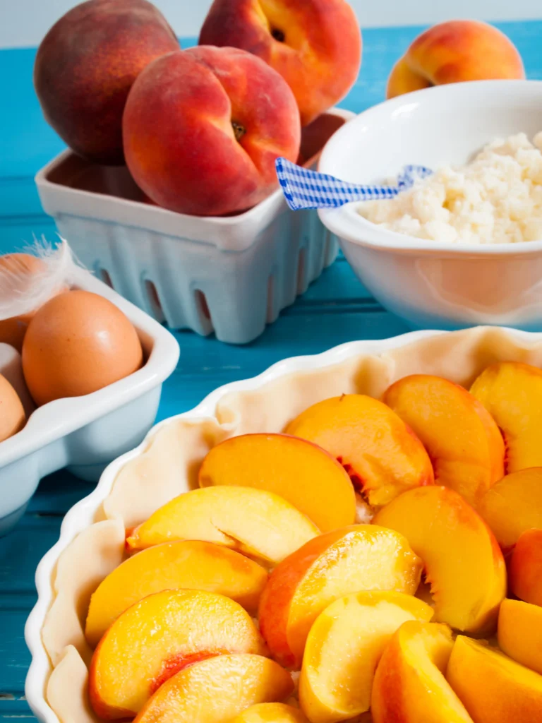 Peach Spoon Cake Recipe
Fresh peach spoon cake served warm in a rustic baking dish, topped with juicy sliced peaches and a golden buttery cake layer, perfect for a comforting summer dessert.