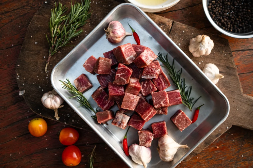 Garlic Butter Steak Bites cooked to perfection in a skillet, coated in rich garlic butter sauce and garnished with fresh parsley.