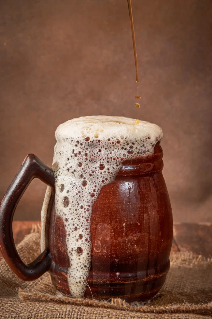 Cold and hot Butterbeer recipe ideas inspired by Harry Potter, featuring creamy foam, butterscotch drink, and cozy wizarding world vibes.