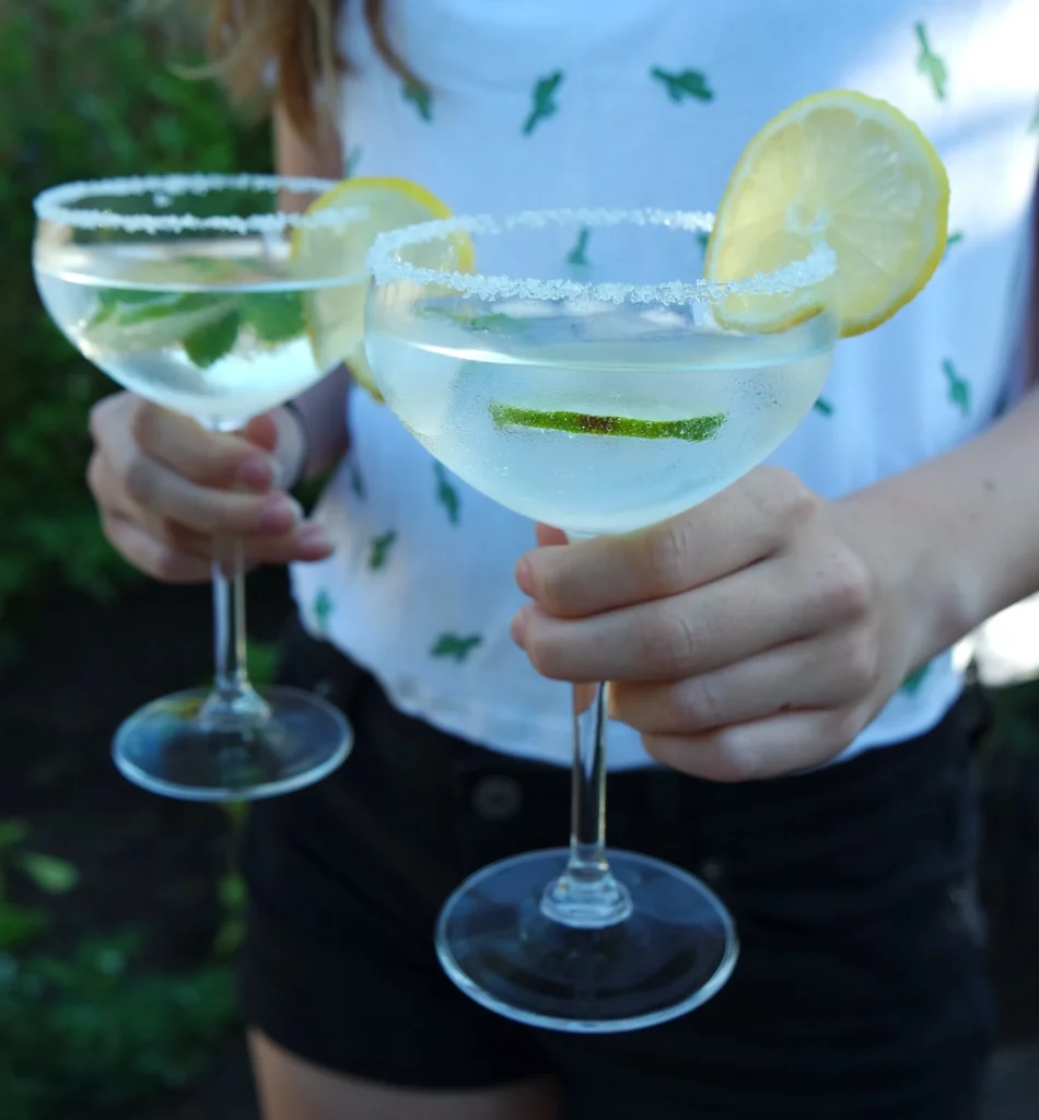Refreshing skinny margarita recipe in a glass with fresh lime and ice