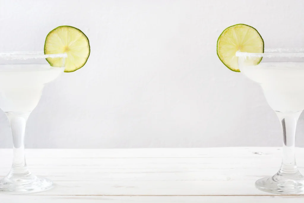 Refreshing skinny margarita recipe in a glass with fresh lime and ice