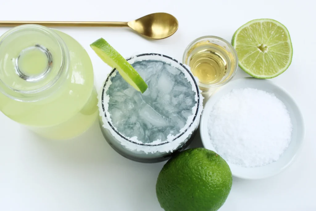 Refreshing skinny margarita recipe in a glass with fresh lime and ice