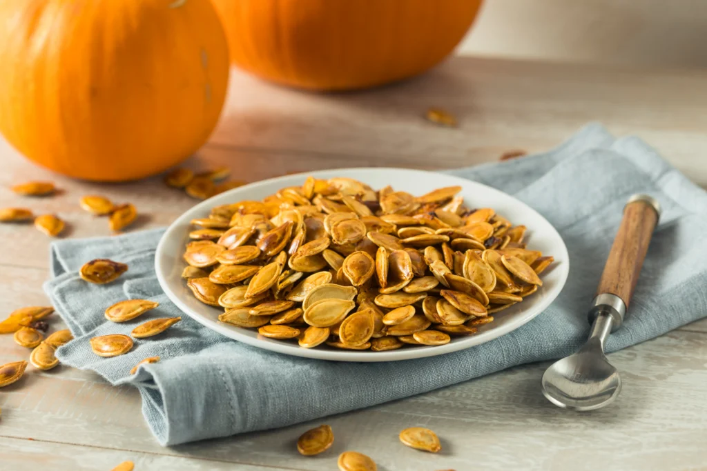 Golden-brown crunchy pumpkin seeds roasted with simple seasonings, served in a rustic bowl and ready for healthy snacking.
