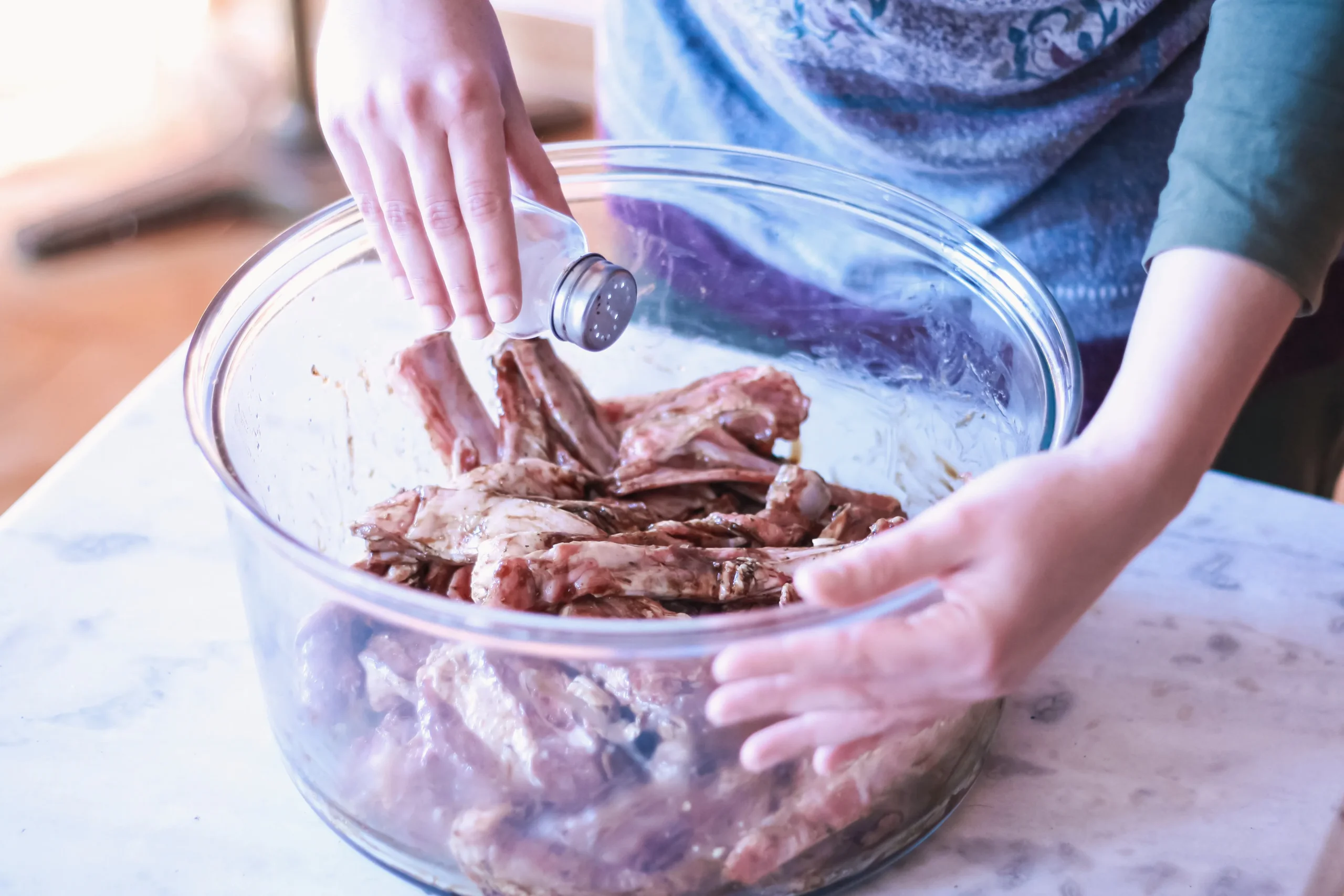 Fall-Off-The-Bone Braised Short Ribs served with rich sauce and vegetables on a rustic plate