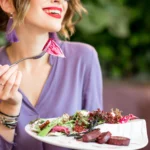 Mediterranean beet salad served with roasted beets, feta cheese, cucumber, red onion, olives, and fresh herbs, drizzled with olive oil and lemon dressing.
