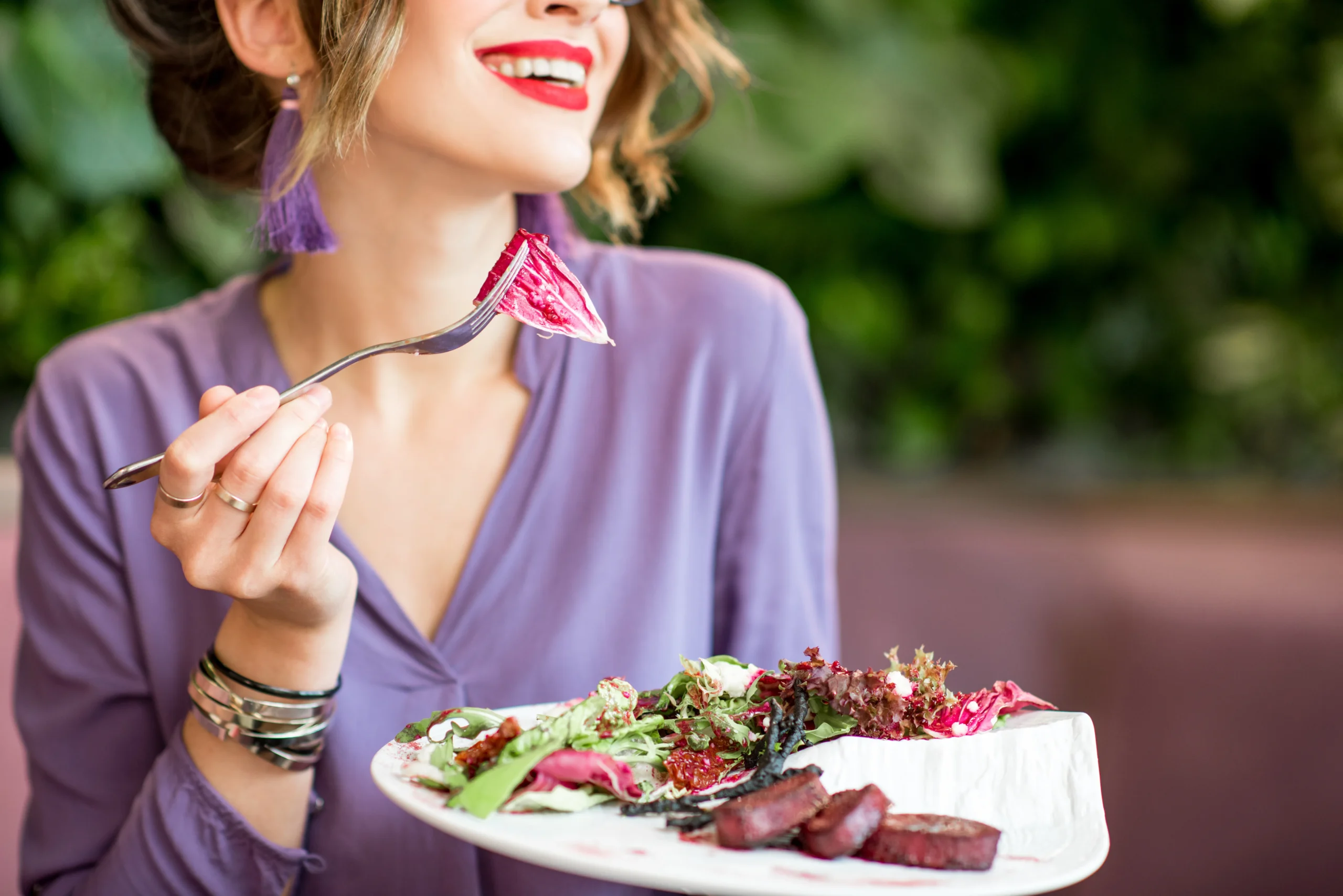 Mediterranean beet salad served with roasted beets, feta cheese, cucumber, red onion, olives, and fresh herbs, drizzled with olive oil and lemon dressing.