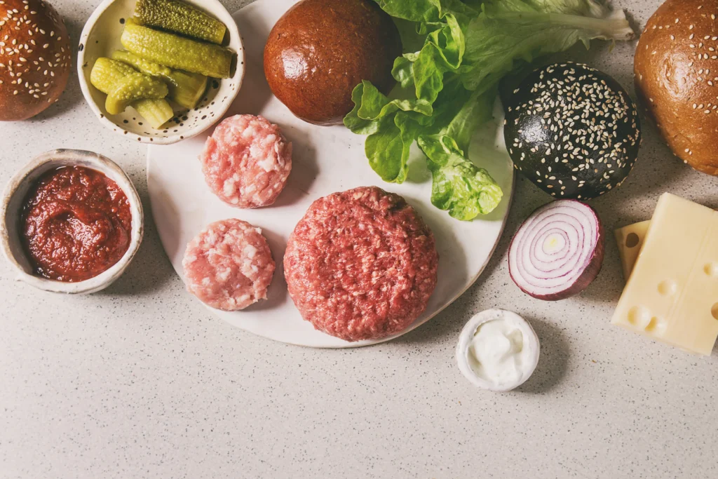 Juicy homemade Smash Burger Recipe with crispy beef patties, melted cheddar cheese, fresh lettuce, tomato, pickles, and a toasted brioche bun served with golden French fries.