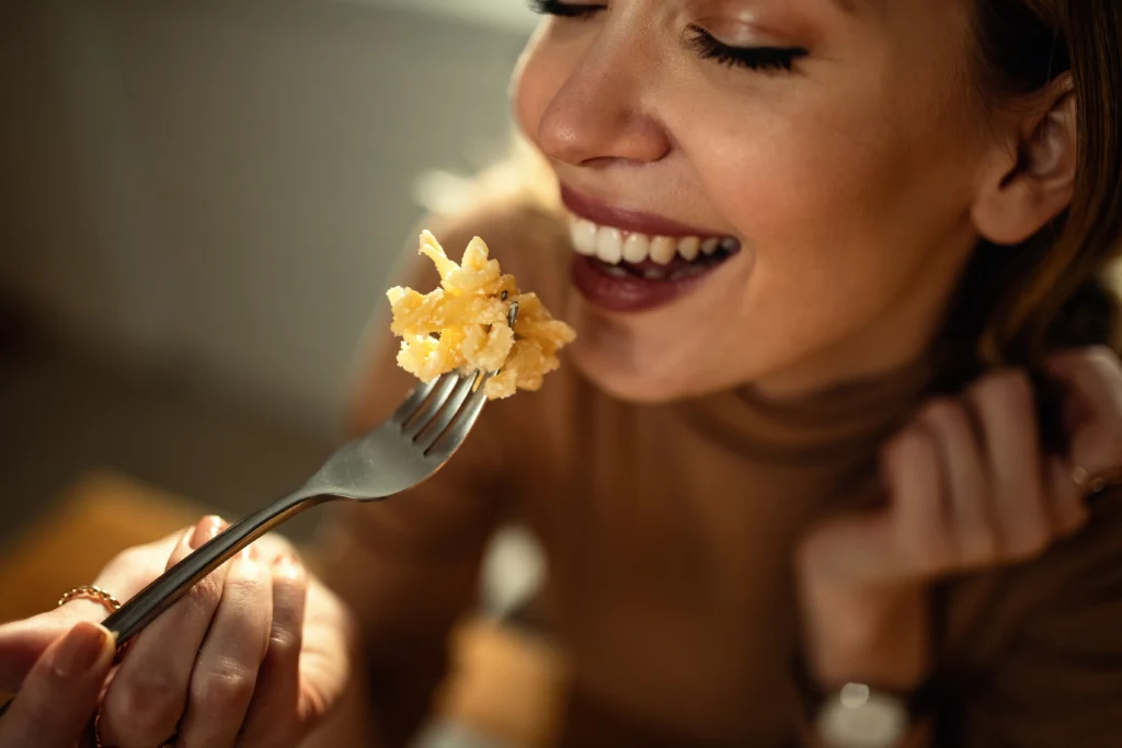 Creamy homemade mac and cheese baked until golden brown with a rich, cheesy sauce, served in a white baking dish just like Grandma's classic comfort food recipe.