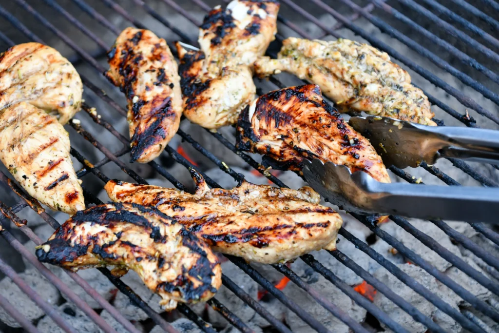 Juicy grilled chicken marinated in a flavorful blend of garlic, herbs, olive oil, lemon juice, and spices, served fresh off the grill.