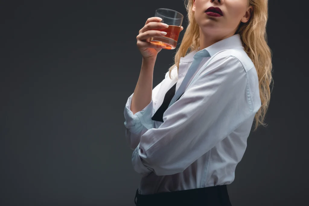 Perfect Classic Old Fashioned Cocktail Recipe with bourbon, orange peel, and ice in a whiskey glass