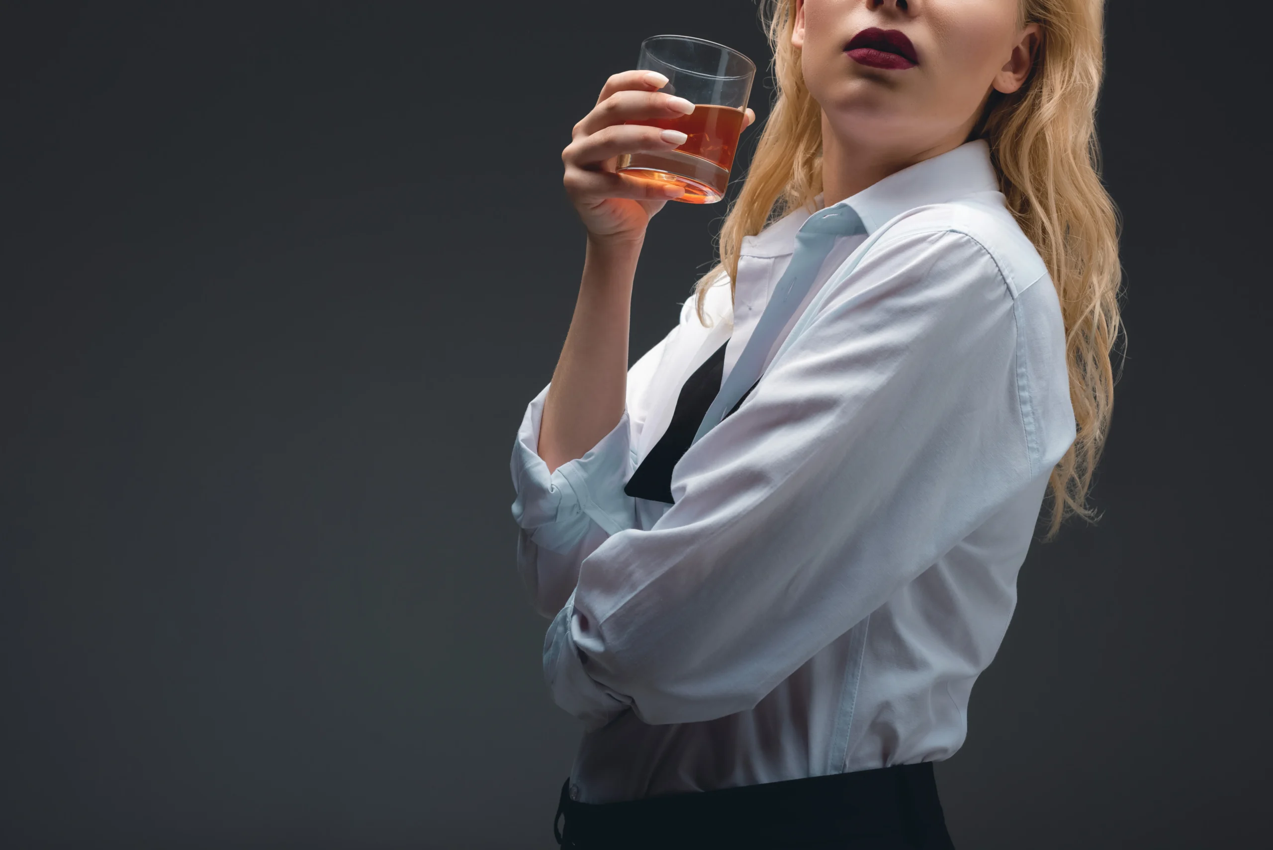 Perfect Classic Old Fashioned Cocktail Recipe with bourbon, orange peel, and ice in a whiskey glass