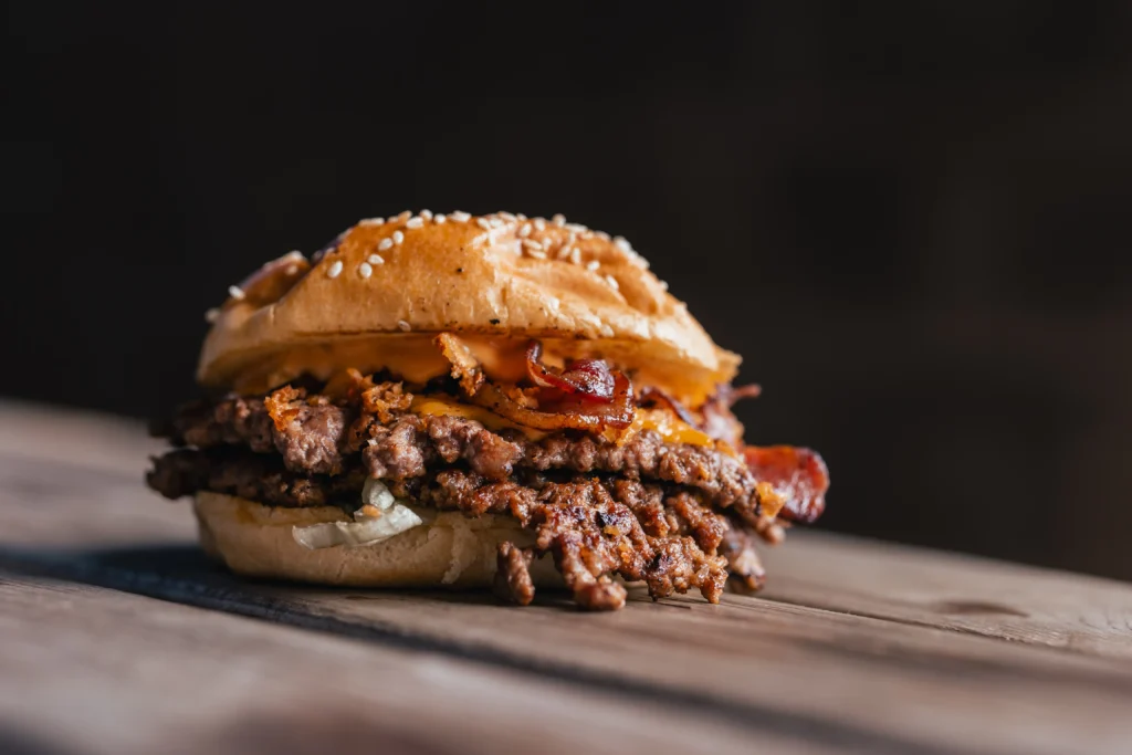 Juicy homemade Smash Burger Recipe with crispy beef patties, melted cheddar cheese, fresh lettuce, tomato, pickles, and a toasted brioche bun served with golden French fries.