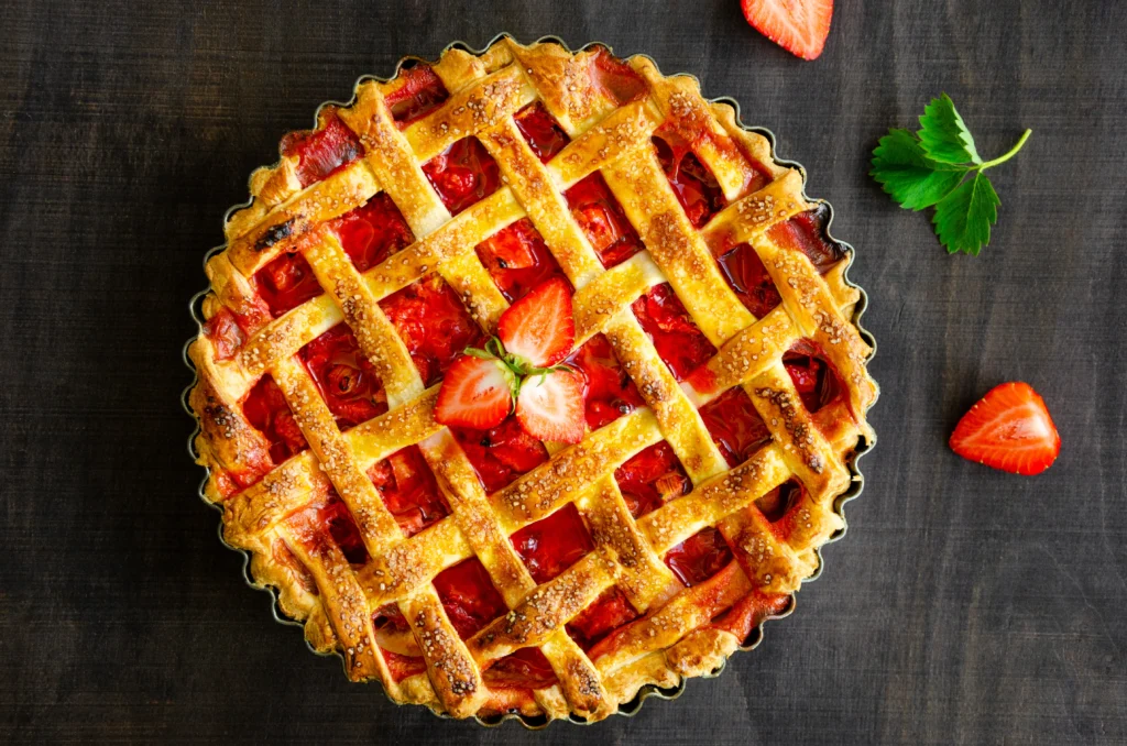 Fresh Strawberry Pie Recipe with juicy strawberries, glossy homemade glaze, and a flaky golden pie crust topped with whipped cream.